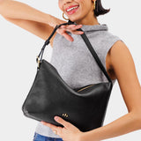 Pebbled--black Large | Medium sized slouchy leather shoulder bag with zipper opening and three metal tree emblems