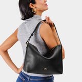 Pebbled--black Large | Medium sized slouchy leather shoulder bag with zipper opening and three metal tree emblems