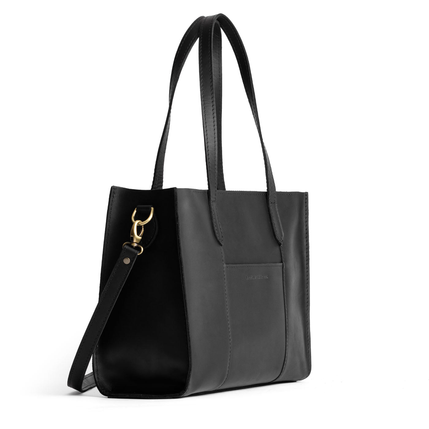 Black*East/West | Structured wide tote bag with overlapping panels and crossbody strap