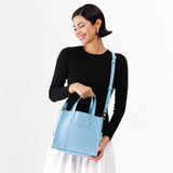 Glacial Blue | Structured mid-size tote bag with overlapping panels and crossbody strap