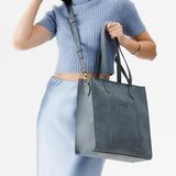 Storm North/South | Structured large tote bag with overlapping panels and crossbody strap