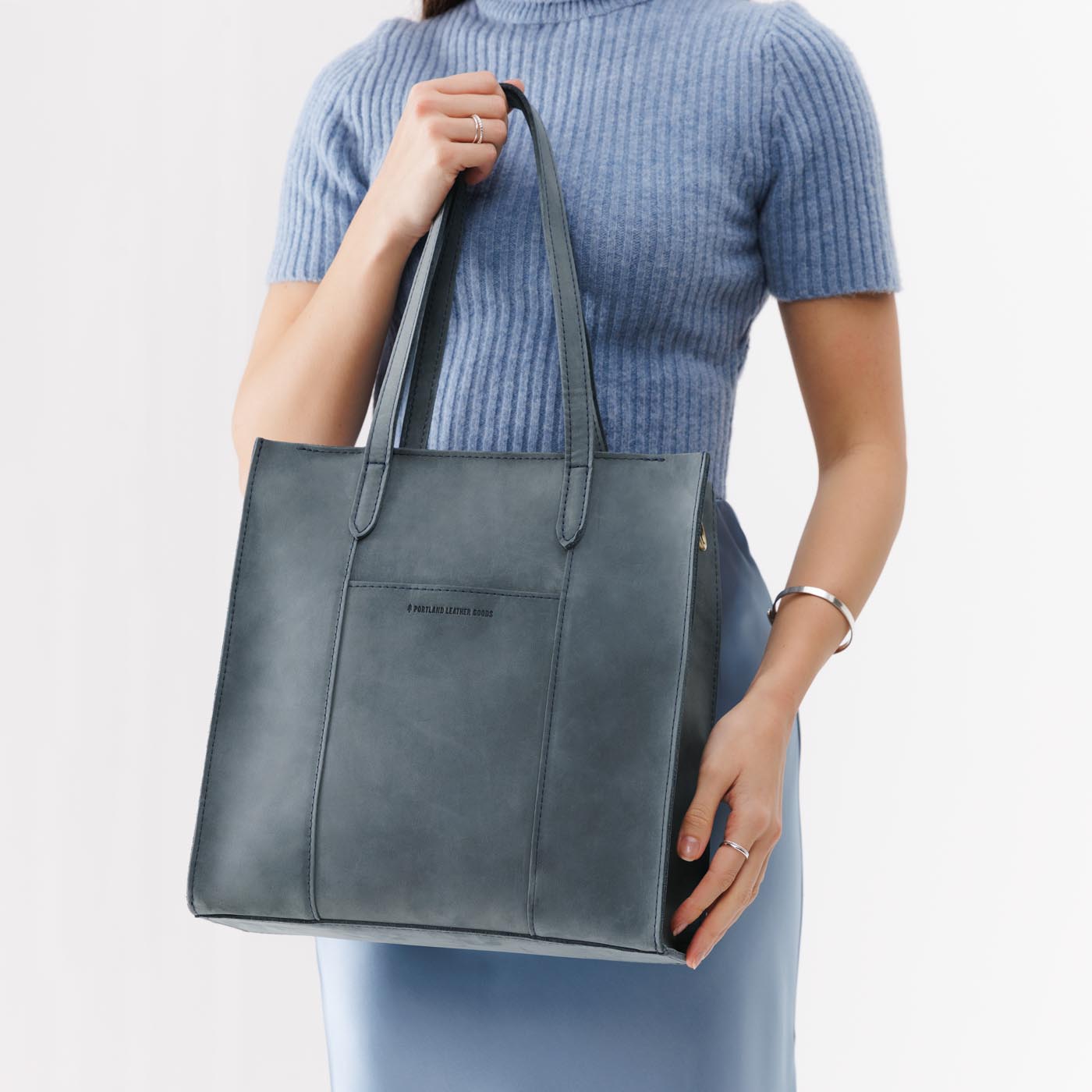 Storm*North/South | Structured large tote bag with overlapping panels and crossbody strap