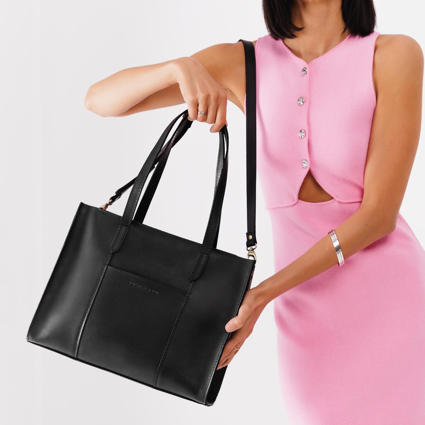 Black*East/West | Structured wide tote bag with overlapping panels and crossbody strap