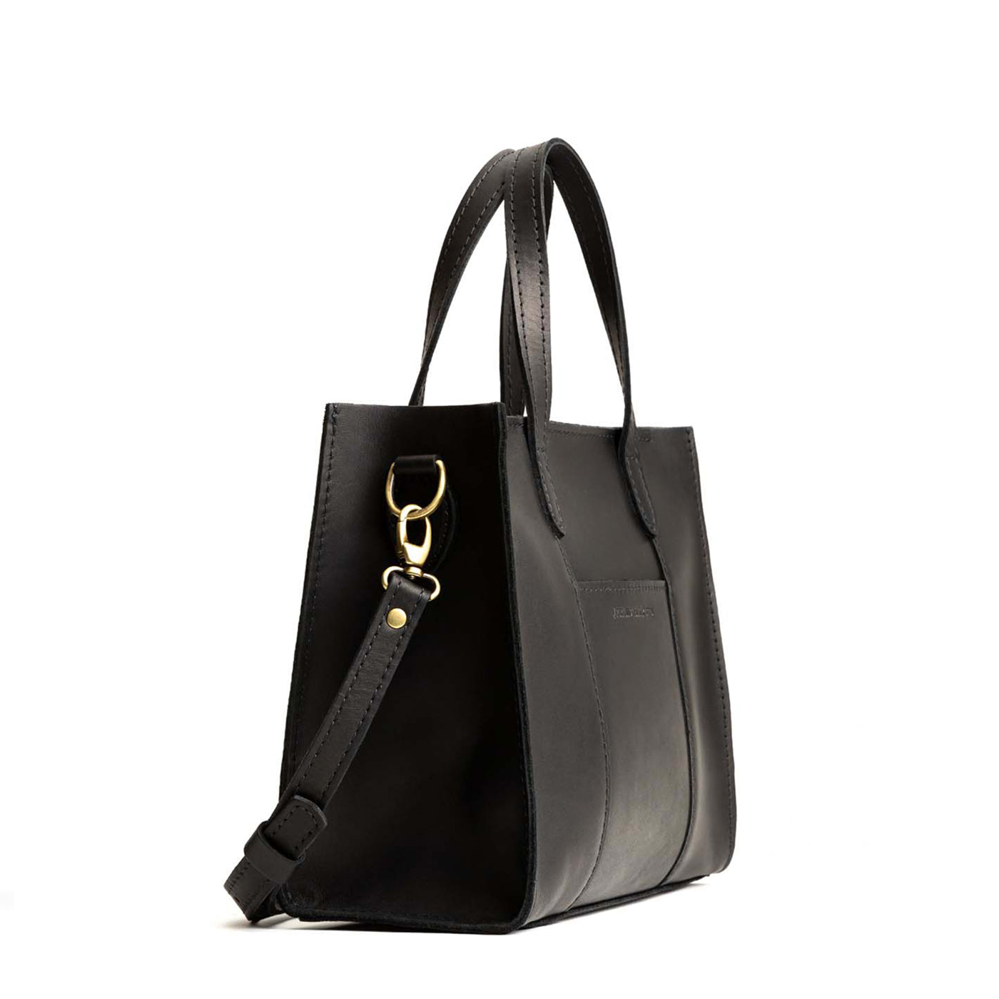 Black*Zipper | Structured mid-size tote bag with overlapping panels and crossbody strap