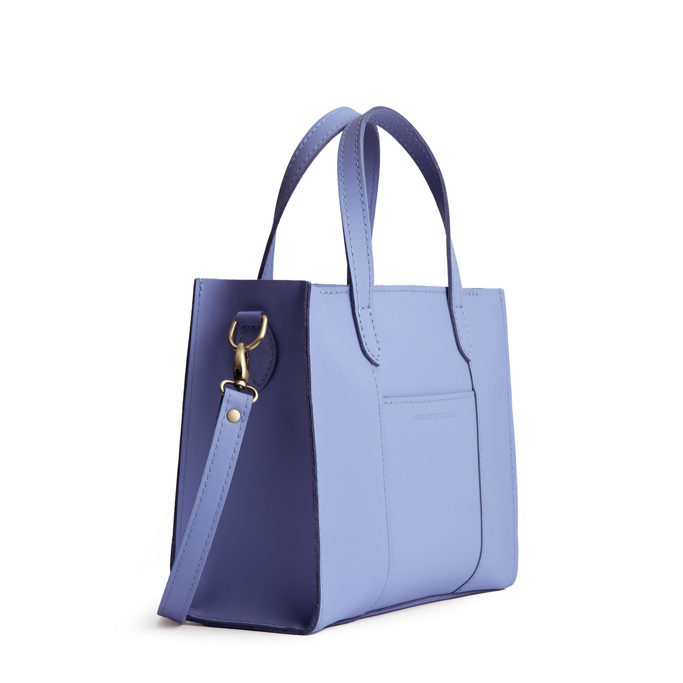 Jacaranda*Zipper | Structured mid-size tote bag with overlapping panels and crossbody strap