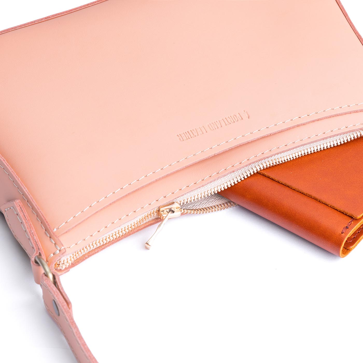 Mamey | Petite bean shaped shoulder bag with a zipper closure