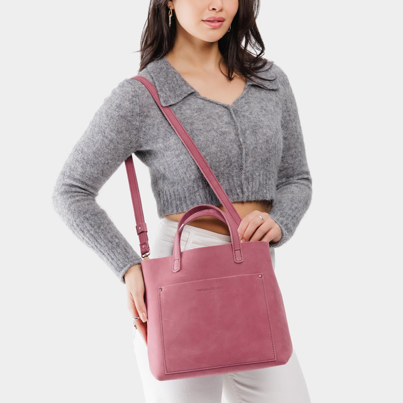 Foxglove*Classic | Model wearing midsize crossbody tote with handles and a pocket