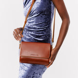 Madrone Medium | Model Wearing Leather Crossbody Bag with Magnetic Messenger Bag Closure