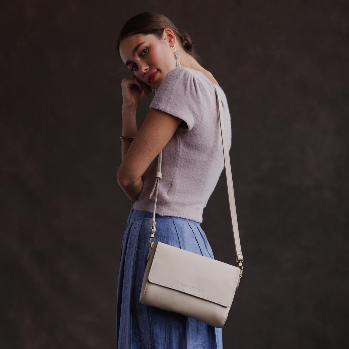 Bone*Medium | Model Wearing Leather Crossbody Bag with Magnetic Messenger Bag Closure