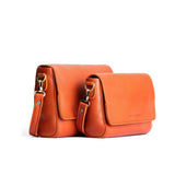 Koi | Side by side of both sizes of leather crossbody bag with magnetic messenger bag closure