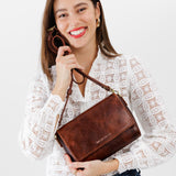 Lava Medium | Model Holding Leather Crossbody Bag with Magnetic Messenger Bag Closure