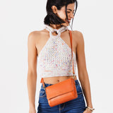 Persimmon Mini | Model Wearing Small Leather Crossbody Bag with Magnetic Messenger Bag Closure