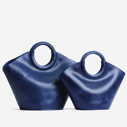 Cowboy Blue*Small | Structured leather hand bag with circular 