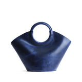 Cowboy Blue Small | Structured leather hand bag with circular 