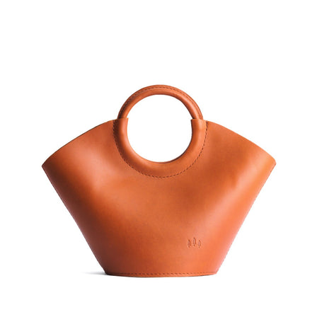 Tuscany*Large | Structured leather hand bag with circular 