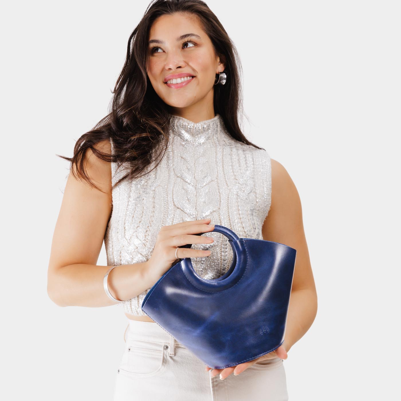 Cowboy Blue*Small | Model holding structured leather hand bag with circular handles