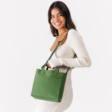 Succulent Classic | Model holding crossbody tote bag with snap closure and front pocket