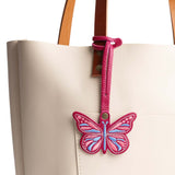 Cosmo | Embroidered butterfly tassel accessory on a bag