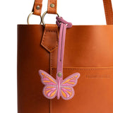 Foxglove | Embroidered butterfly tassel accessory on a bag