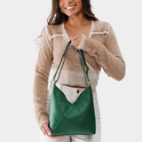 Bacalar Small | Model holding petite shoulder bag with adjustable strap and magnetic snap closure