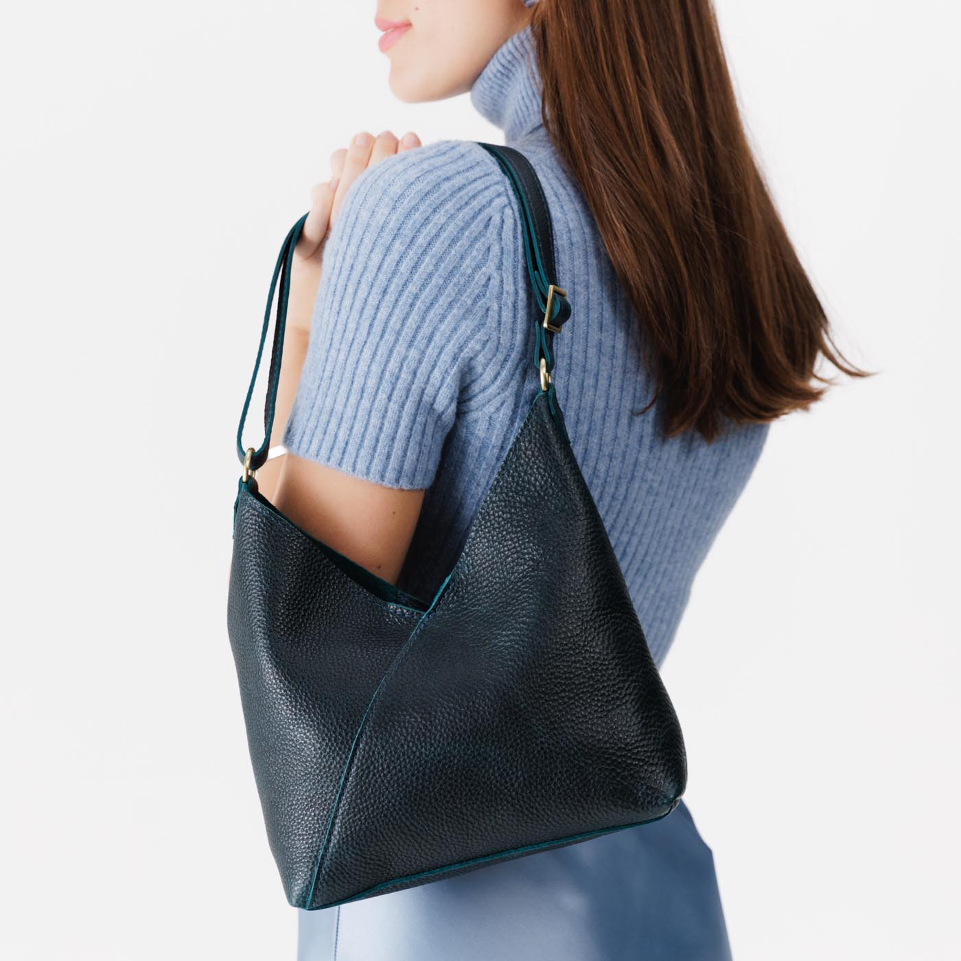 Boreal*Small | Model wearing petite shoulder bag with adjustable strap and magnetic snap closure