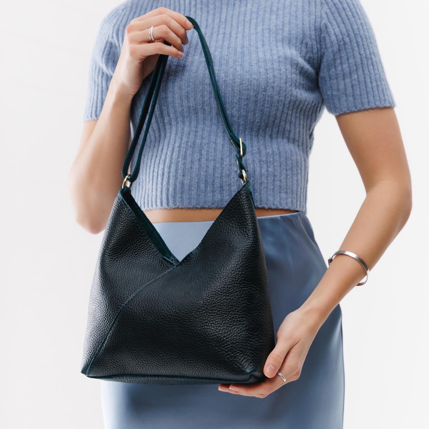 Boreal*Small | Model wearing petite shoulder bag with adjustable strap and magnetic snap closure