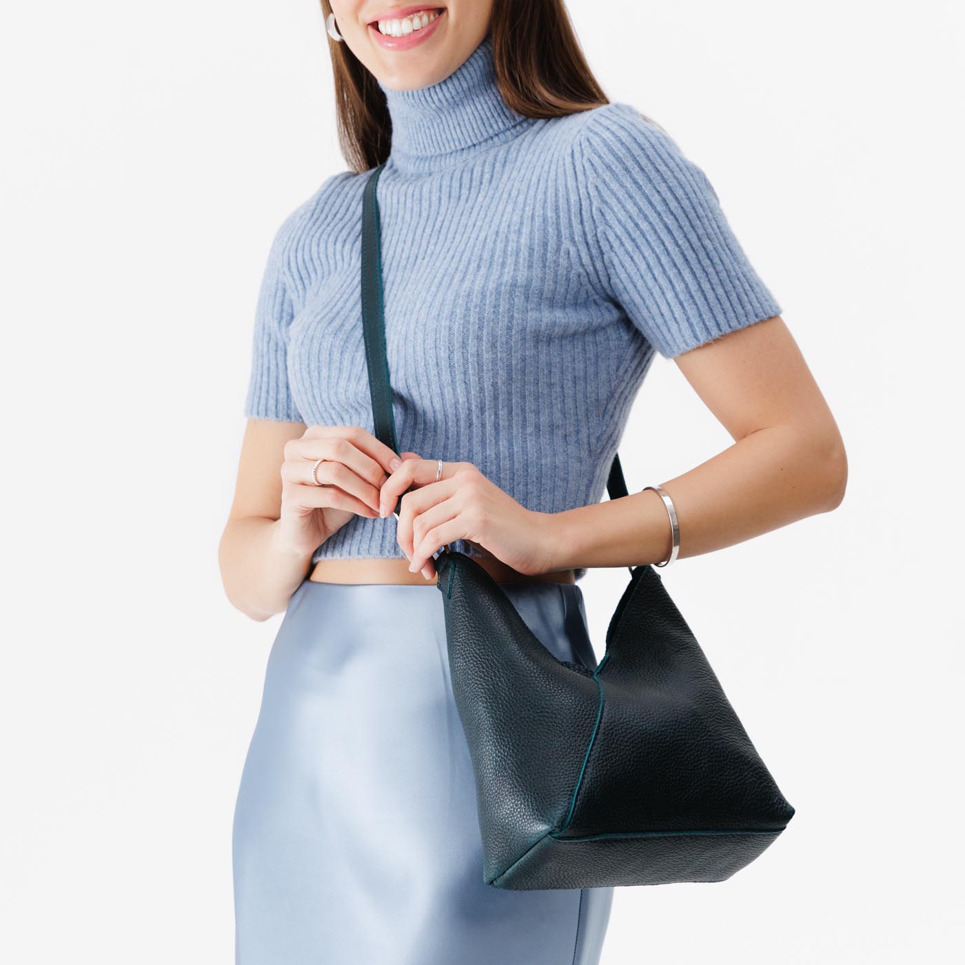 Boreal*Small | Model wearing petite shoulder bag with adjustable strap and magnetic snap closure