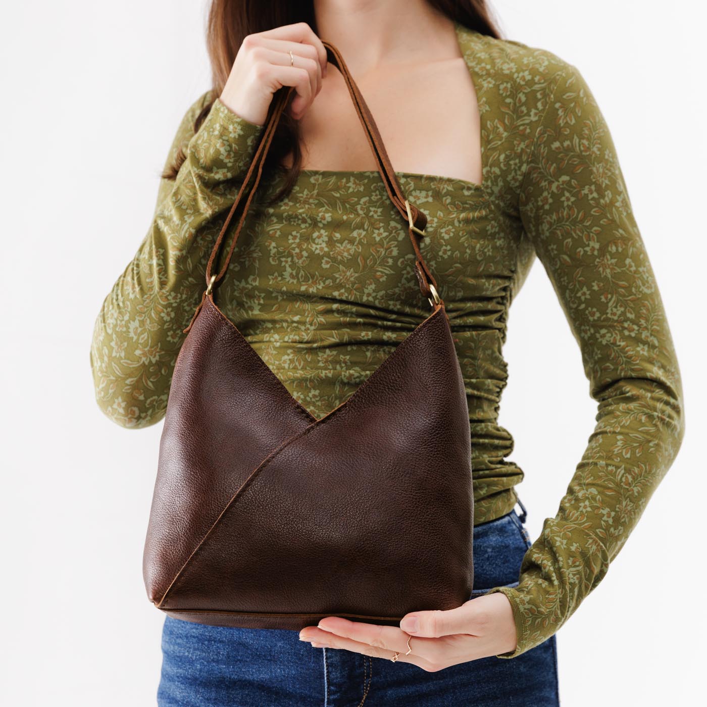 Coldbrew*Small | Model holding petite shoulder bag with adjustable strap and magnetic snap closure