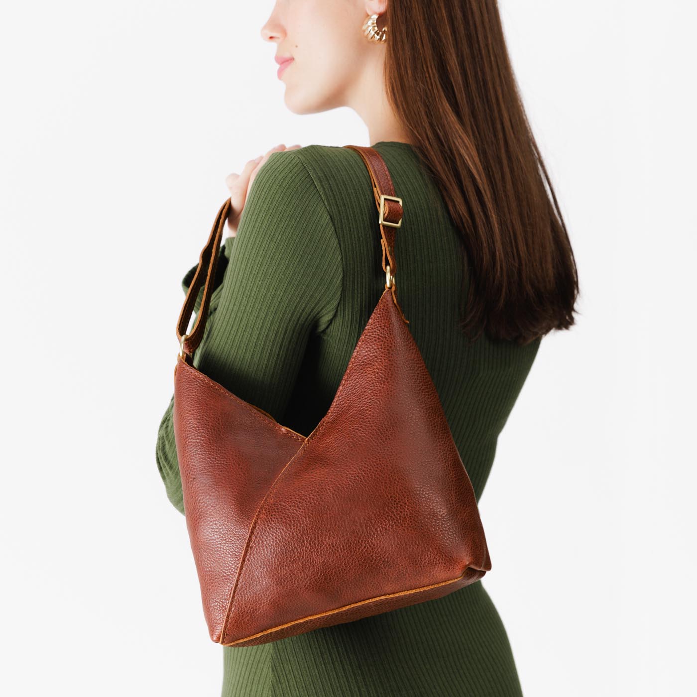 Nutmeg*Small | Model wearing petite shoulder bag with adjustable strap and magnetic snap closure