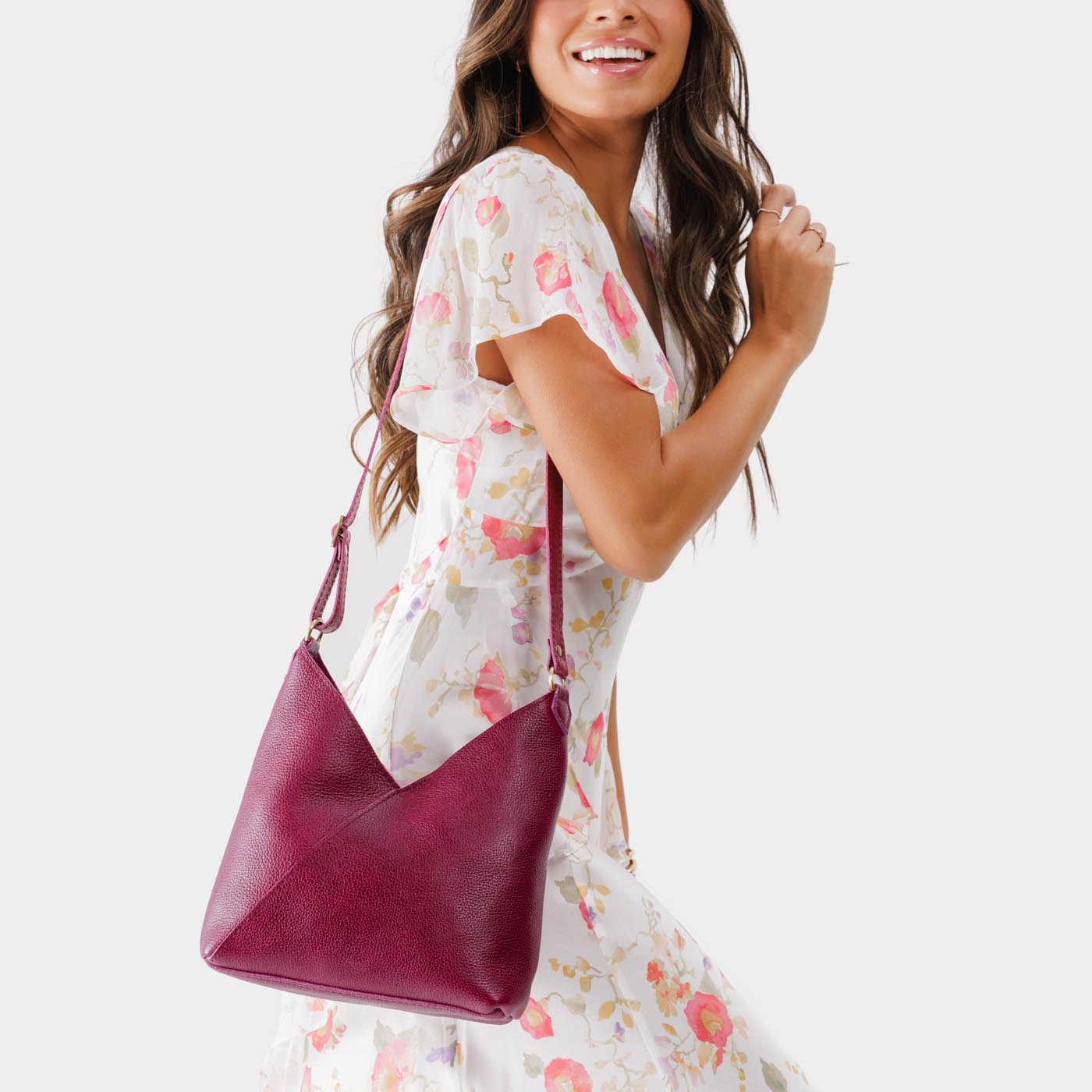 Orchid*Small | Model wearing petite shoulder bag with adjustable strap and magnetic snap closure