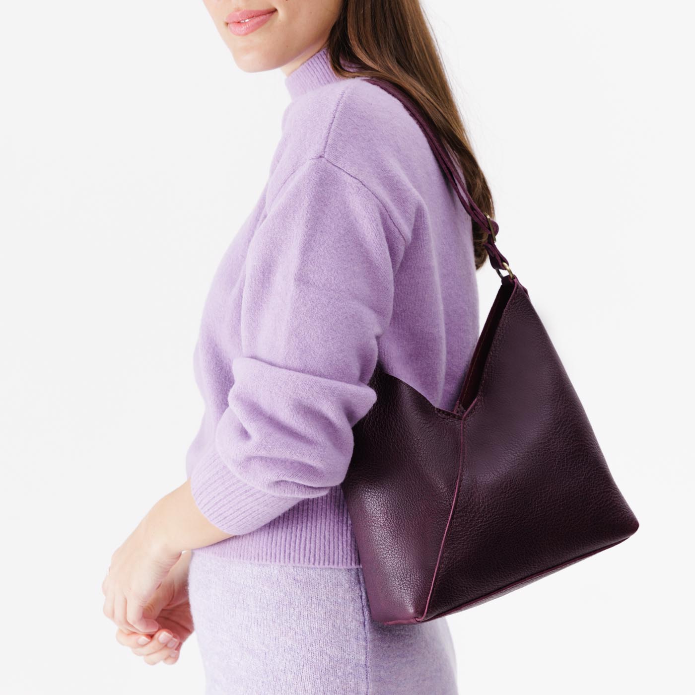 Plum*Small | Model wearing petite shoulder bag with adjustable strap and magnetic snap closure