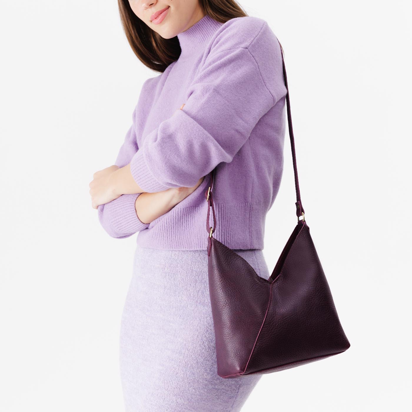 Plum*Small | Model wearing petite shoulder bag with adjustable strap and magnetic snap closure