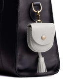 Nimbus | U shaped pouch with snap closure, lobster clasp and fringed tassel