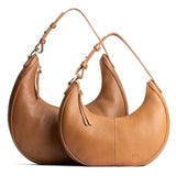 Shortbread | Crescent shaped shoulder bag with zipper closure and adjustable strap