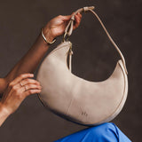 Dragon Bone Classic | Crescent shaped shoulder bag with zipper closure and adjustable strap