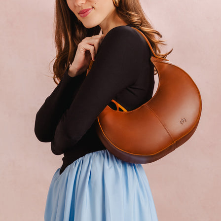 Honey*Classic | Crescent shaped shoulder bag with zipper closure and adjustable strap