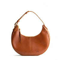 Honey*Classic | Crescent shaped shoulder bag with zipper closure and adjustable strap