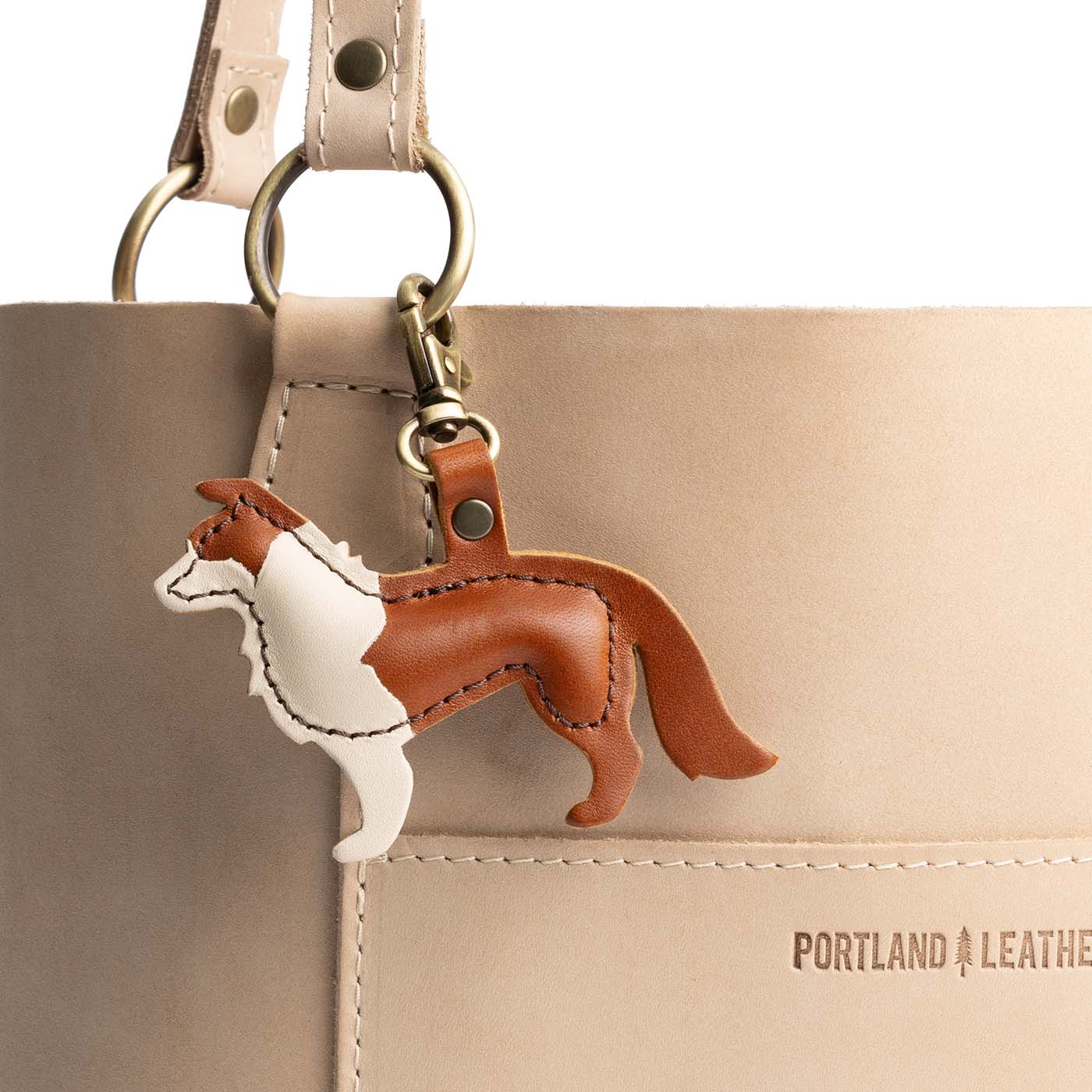 Honey | Leather border collie shaped keychain with metal lobster clasp