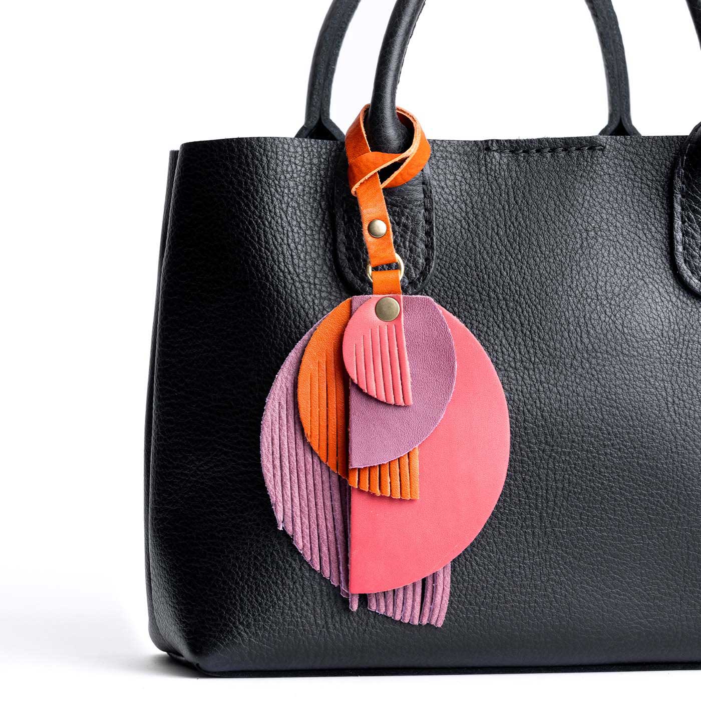 Merry Berry  | Intricately cut leather shapes and fringe on a bag