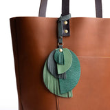 Rain Forest | Intricately cut leather shapes and fringe