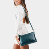 Lagoon | Model wearing midsize zip top crossbody bag with detachable strap