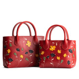 Folklore Ruby | Petite tote purse with embroidered flower design, structured leather handles, and crossbody strap