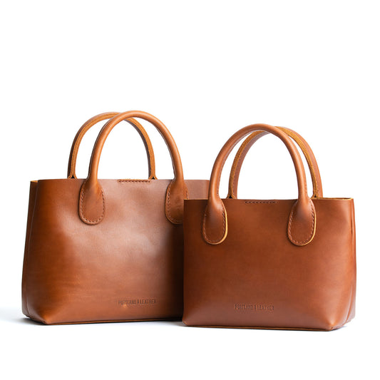 Honey  | Side by side of both tote purses with structured leather handles and crossbody strap