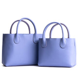 Jacaranda | Side by side of both tote purses with structured leather handles and crossbody strap