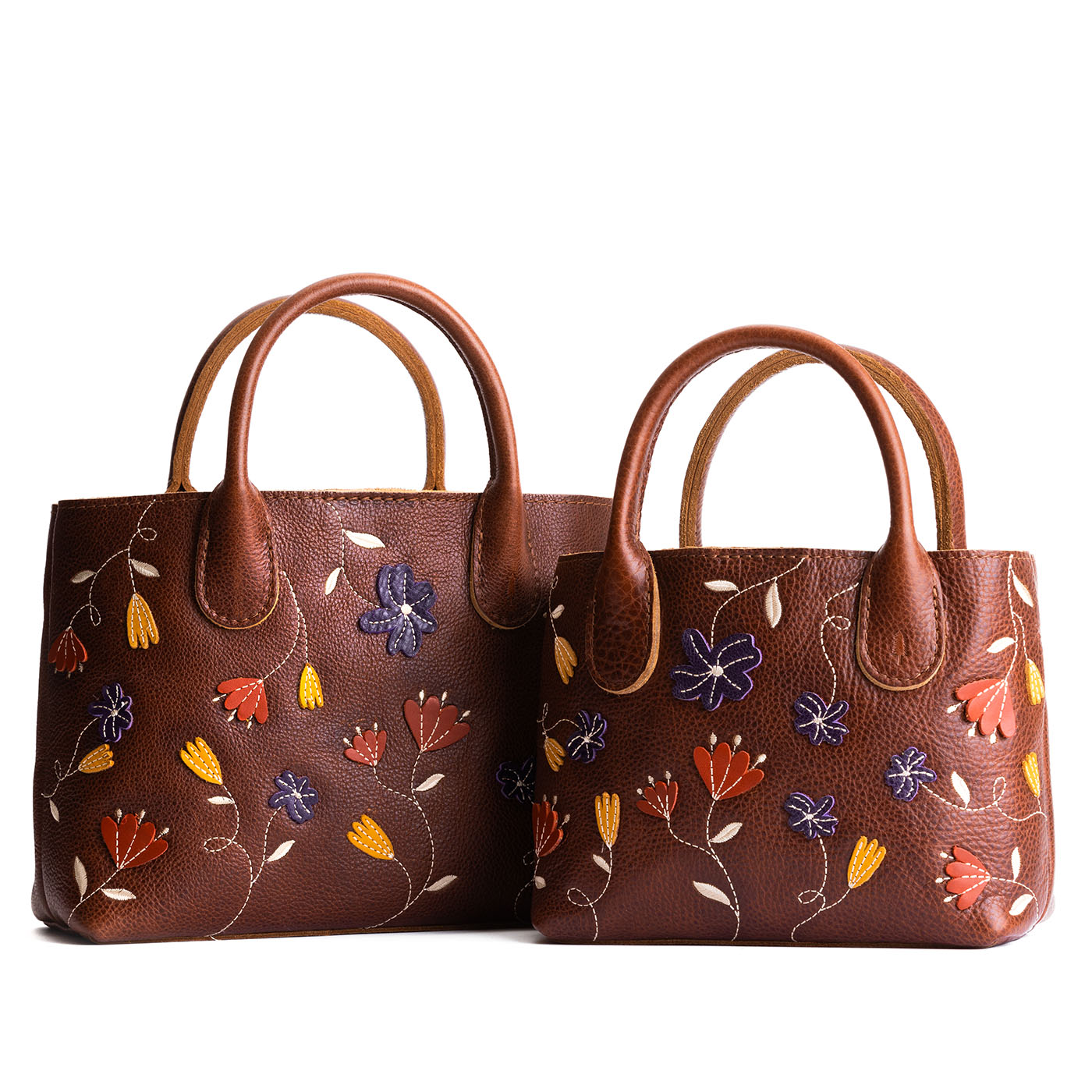 Folklore Nutmeg | Petite tote purse with embroidered flower design, structured leather handles, and crossbody strap