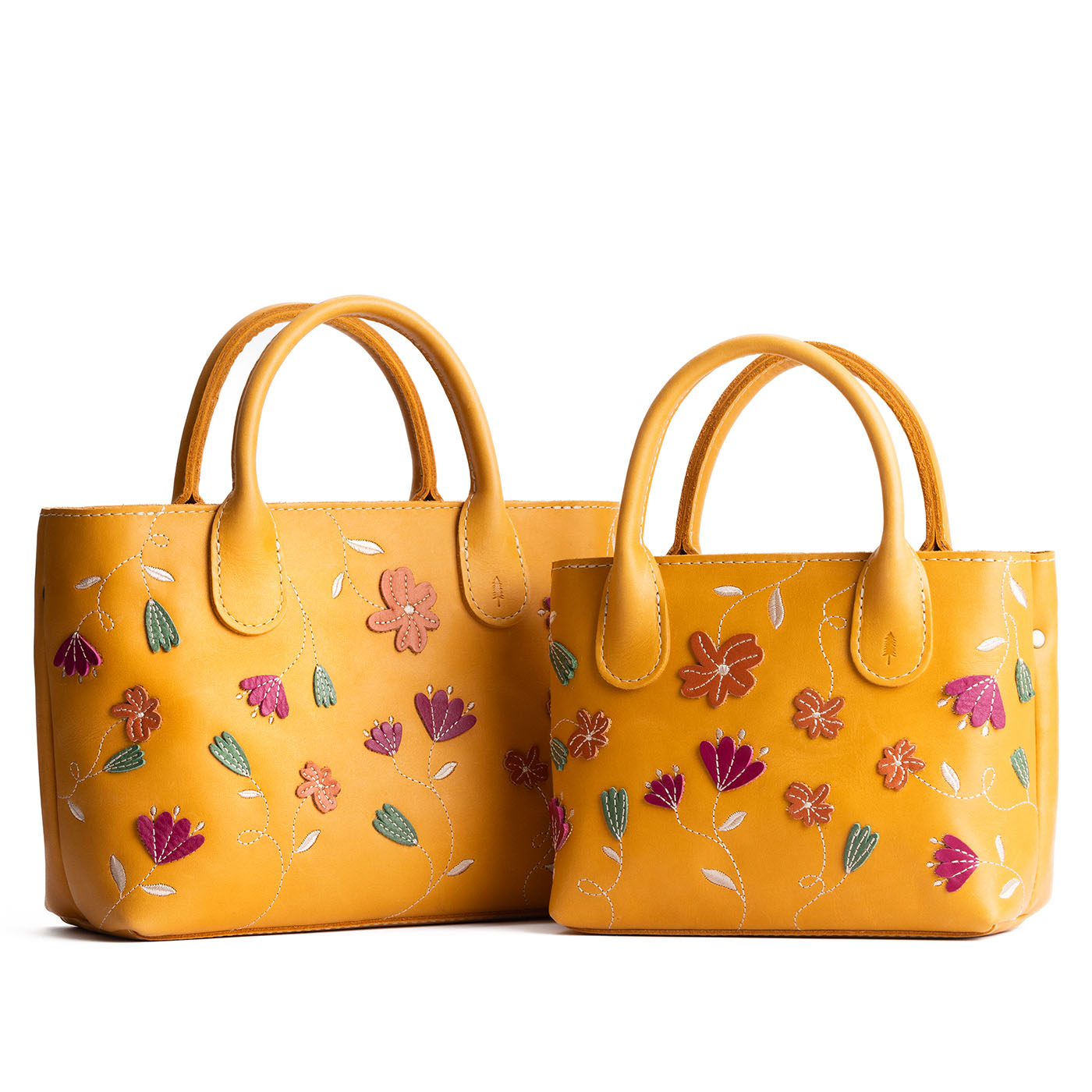 Folklore Sunflower | Petite tote purse with embroidered flower design, structured leather handles, and crossbody strap