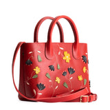 Folklore Ruby Large | Mid-size tote purse with embroidered flower design, structured leather handles, and crossbody strap