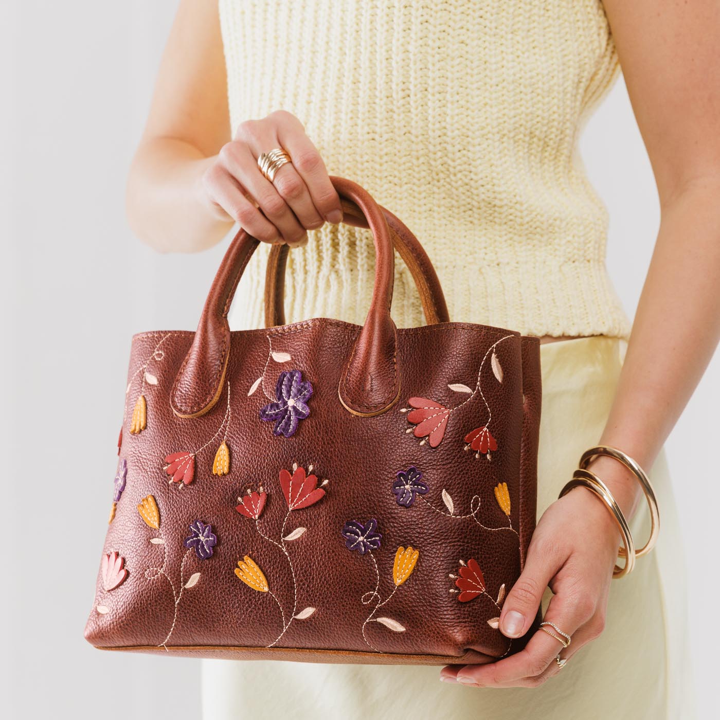 Folklore Nutmeg*Large | Mid-size  tote purse with embroidered flower design, structured leather handles, and crossbody strap