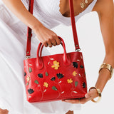 Folklore Ruby Large | Mid-size tote purse with embroidered flower design, structured leather handles, and crossbody strap