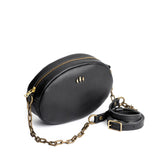 Pebbled--black | Oval leather purse with metal crossbody chain strap and adjustable leather shoulder guard